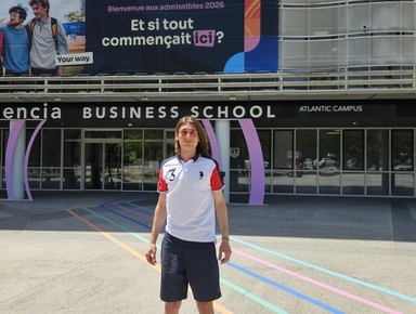 Photo of a student posing in front of the Audencia Atlantic Campus