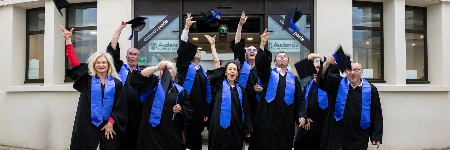 Graduates throwing their hats