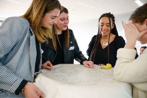 Students working around a table