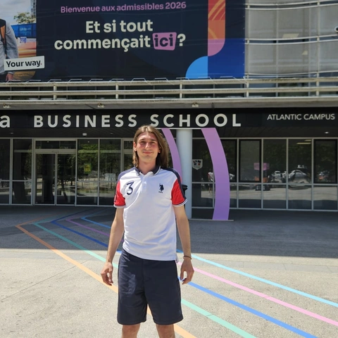 Photo of a student posing in front of the Audencia Atlantic Campus